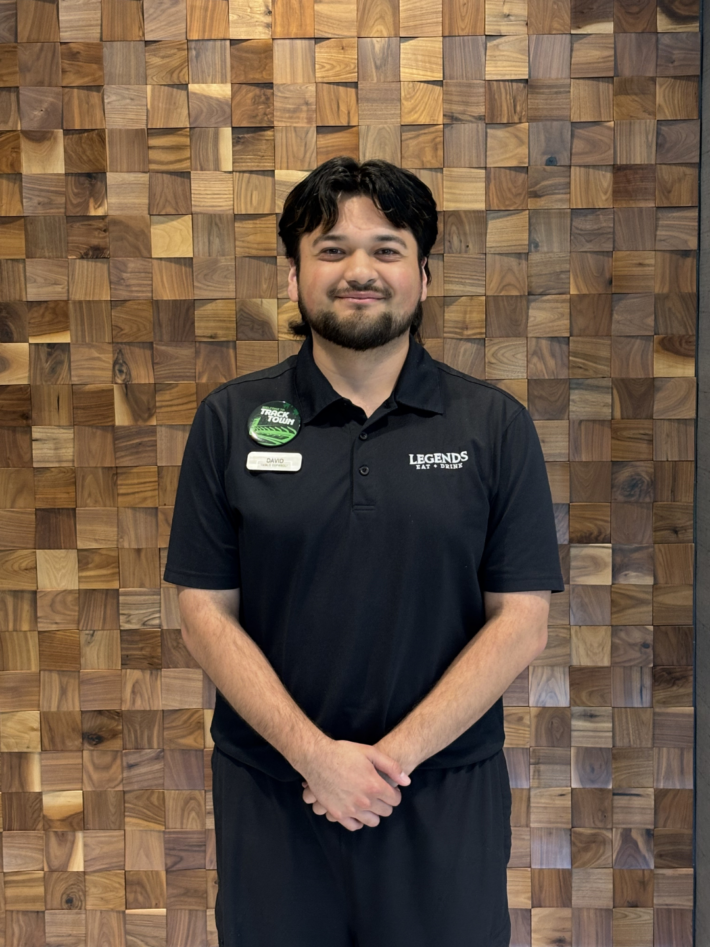 David, a University of Oregon General Social Sciences student, smiling confidently as he works toward a future in hospitality.