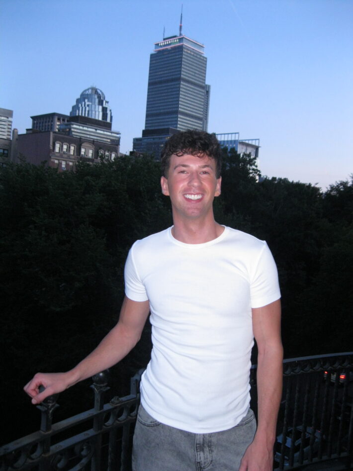 Connor Weiss, from South Carolina standing in front of buildings.